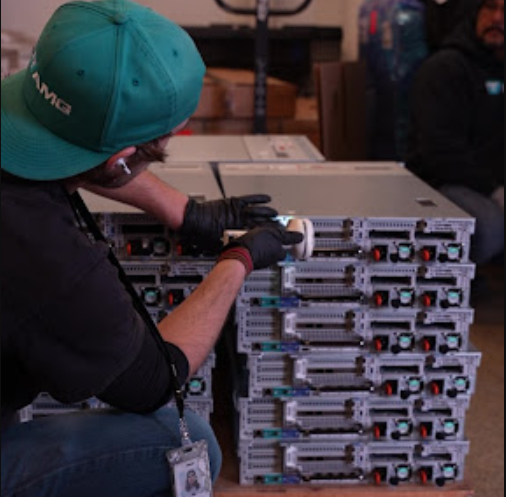 ITAD professional scanning and handling IT equipment in a professional ITAD facility