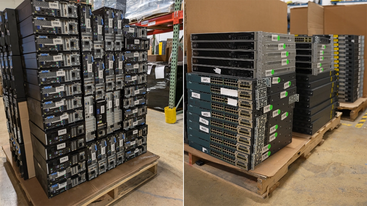 Stacks of decommissioned enterprise servers, network switches, and storage equipment prepared for IT asset recovery and resale in a warehouse.